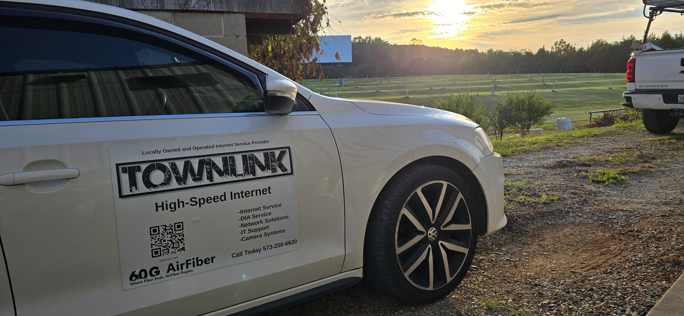 TownLink branded vehicle at a sunset field install