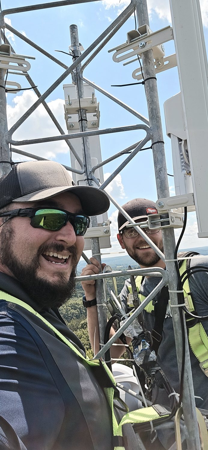 TownLink crew working safely on tower-mounted equipment